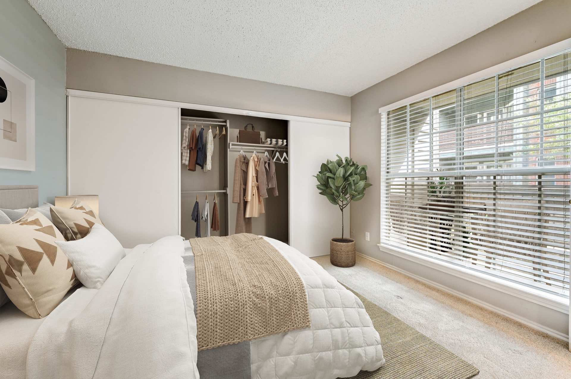Bedroom with large closet and large window